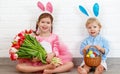 Happy easter! funny funny children with ears hare getting read