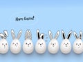 Happy Easter funny cute rabbits with easter eggs on light blue background