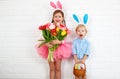 Happy easter! funny funny children with ears hare getting read