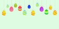 Happy Easter greeting banner with colored eggs. Multi-colored painted eggs are hung on ropes
