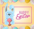 Happy Easter greeting card with blue fluffy bunny that is holding decorated and painted egg. Royalty Free Stock Photo