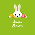 Happy Easter greeting card with hiding bunny, Easter eggs and grass on green background