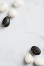 Happy Easter greeting card  vertical banner mockup. Elegant black and white Easter eggs decorated gold on marble background. Royalty Free Stock Photo