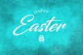 Happy Easter Greeting on a teal background