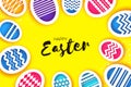Happy Easter Greetings card. Colorful Eggs in paper cut style. Spring holidays on yellow. Space for text. Royalty Free Stock Photo