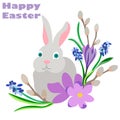 happy Easter. The grey Easter bunny sits in spring flowers crocuses, willow, primrose. Congratulations for Easter and