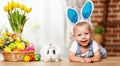 Happy easter! happy funny baby boy playing with bunny