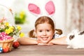 Happy easter! happy funny child girl playing with bunny Royalty Free Stock Photo