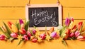 Happy Easter holiday greeting with spring flowers Royalty Free Stock Photo