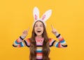 happy easter kid in bunny ears and bow tie on yellow background. inspired with idea Royalty Free Stock Photo
