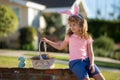 Happy Easter. Kids in bunny ears with Easter egg in basket. Boy play in hunting eggs. Easter holiday. Royalty Free Stock Photo
