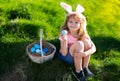 Happy Easter. Kids in bunny ears with Easter egg in basket. Boy play in hunting eggs. easter basket Royalty Free Stock Photo