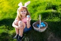 Happy Easter. Kids in bunny ears with Easter egg in basket. Boy play in hunting eggs. easter basket Royalty Free Stock Photo