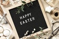 Happy Easter letter board and spring table setting top view