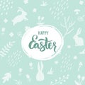 Happy Easter lettering on light green background with bunny silhouette and floral decorative elements. Royalty Free Stock Photo