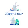 happy easter lettering with two easter hares and colored eggs Royalty Free Stock Photo