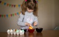 Happy easter. Little girl painter painted eggs. Kid preparing for Easter. Painted hand. Finger paint. Art and craft concept Royalty Free Stock Photo