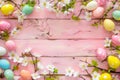 Happy easter loved ones card Eggs Eggstraordinary Basket. White bunny bedding Bunny rosebud pink. Red Iris background wallpaper Royalty Free Stock Photo
