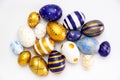 Happy Easter.Many easter eggs trendy colored classic blue, white and golden on white. Minimal style, top view, flatlay