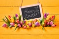 Happy Easter message with fresh spring tulips Royalty Free Stock Photo