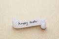 Happy easter message written on paper scroll Royalty Free Stock Photo