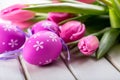 Happy easter. Multicolored spring tulips and Easter eggs. Spring and Easter decorations