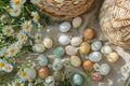 Happy easter orange squeeze Eggs Celebration Basket. White easter throw blanket Bunny organizing. Egg painting background Royalty Free Stock Photo