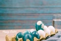 Happy easter, organic blue easter egg standing on the white color eggs wait for painting, easter holiday decorations Royalty Free Stock Photo