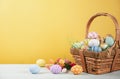 Happy easter, Easter painted eggs in the basket on wooden rustic table for your decoration in holiday. copy space