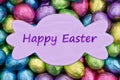 Happy Easter pale purple greeting card with colorful shiny Easter eggs