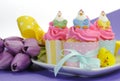 Happy Easter pink, yellow and blue cupcakes with copy space Royalty Free Stock Photo