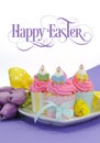 Happy Easter pink, yellow and blue cupcakes with sample text Royalty Free Stock Photo