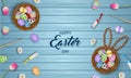 Happy easter poster with colorful eggs, flowers and tempera tubes on wooden background