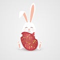 Happy Easter. Easter Rabbit bunny with realistic big egg with spots isolated on gray background. Cute, funny cartoon Royalty Free Stock Photo