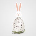 Happy Easter. Easter Rabbit bunny with realistic big egg with spots isolated on gray background. Cute, funny cartoon Royalty Free Stock Photo
