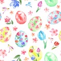 Happy Easter seamless pattern with colored eggs and spring flowers on white background.