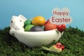 Happy Easter sign with white bunny rabbit bowl of eggs