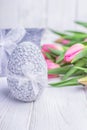 Happy Easter. Easter egg and pink tulips on a white background Royalty Free Stock Photo