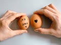 Happy Easter or st valentines morning before breakfast. Young couple holding eggs with declaration of love. Art on eggs