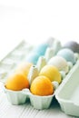 Happy Easter. Stylish Easter eggs in rainbow pastel colors in carton tray on white wooden background, space for text. Modern Royalty Free Stock Photo