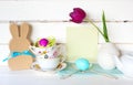 Happy Easter Tea Party or Meal Invite Card with Tea Cups, Bunny, Flower, Egg and Silverware in Modern Whimsical Arrangement