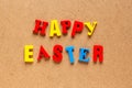 Happy Easter text on cardboard background