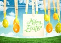 Happy Easter text with Easter Eggs with note on pegs in front of pattern