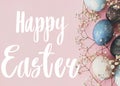 Happy Easter text. Easter greetings card. Stylish easter eggs and spring flowers border on pink paper flat lay. Modern natural Royalty Free Stock Photo