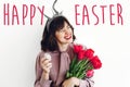 Happy Easter text. season`s greetings card. Beautiful happy girl Royalty Free Stock Photo