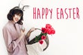 Happy Easter text. season`s greetings card. Beautiful happy girl Royalty Free Stock Photo