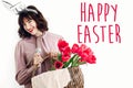 Happy Easter text. season`s greetings card. Beautiful happy girl Royalty Free Stock Photo