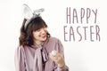 Happy Easter text. season`s greetings card. Beautiful happy girl Royalty Free Stock Photo