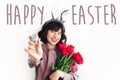 Happy Easter text. season`s greetings card. Beautiful happy girl Royalty Free Stock Photo