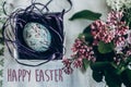 Happy easter text sign on easter egg in nest with floral and ch Royalty Free Stock Photo